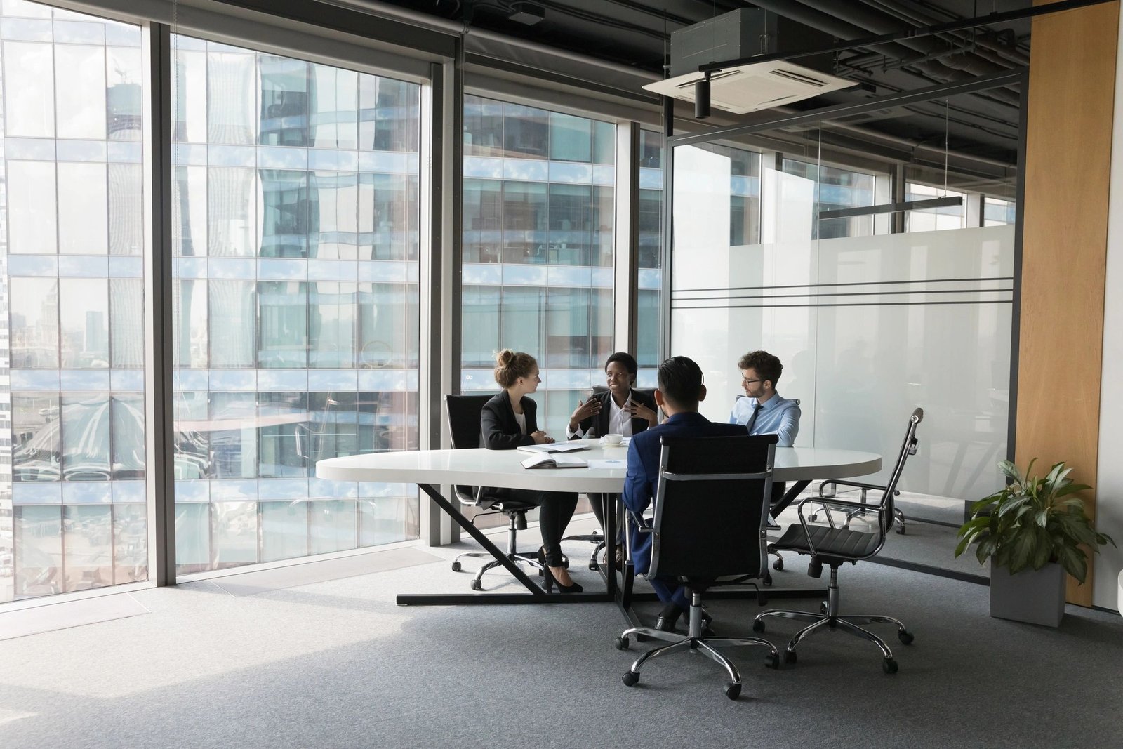 Business team discussing a project in a modern meeting room