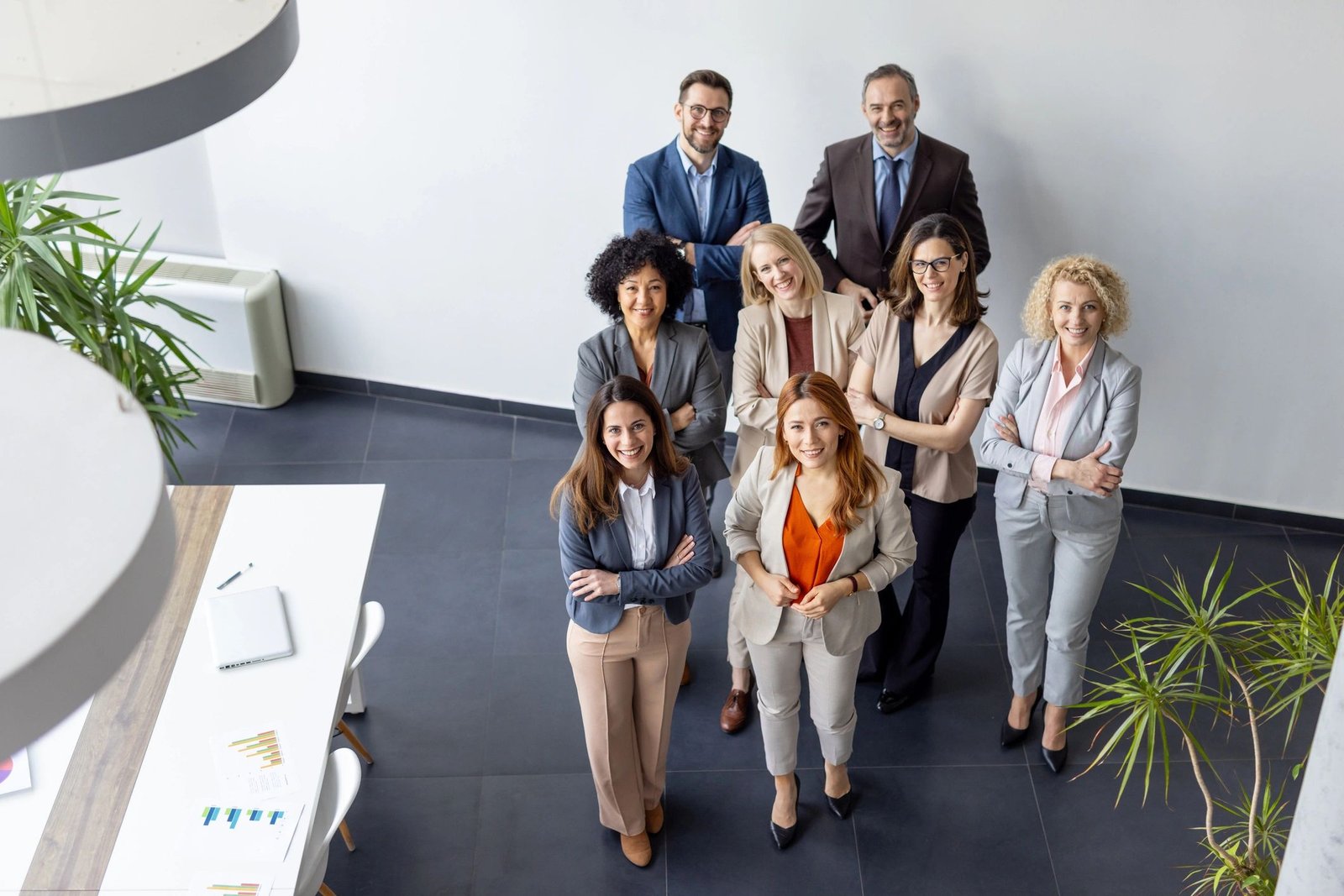 Professional agency team standing together in an office