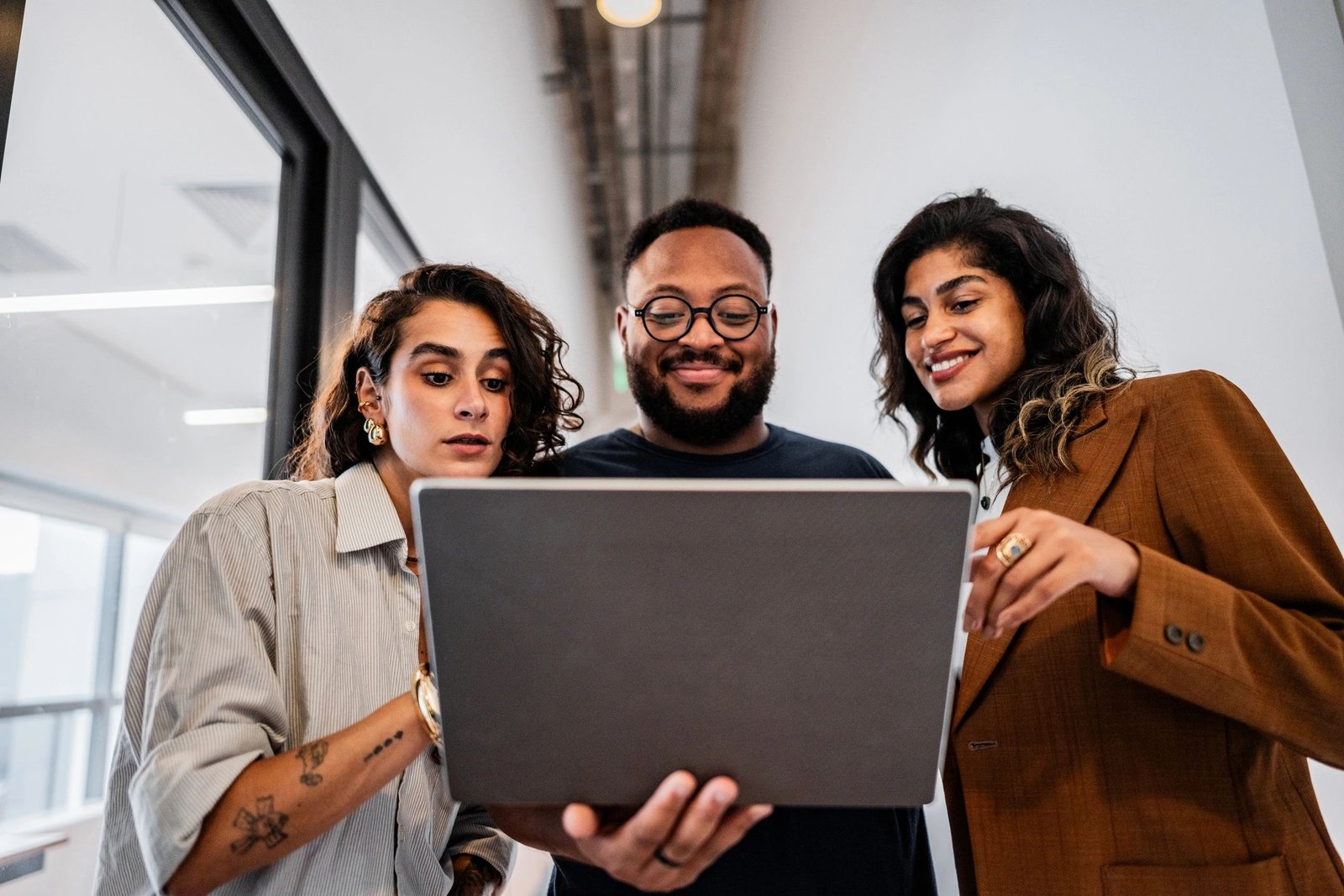 Coworkers reviewing ecommerce marketing performance on a laptop
